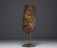 China - Nuo theatrical ritual exorcism mask in polychrome wood, 18th century.