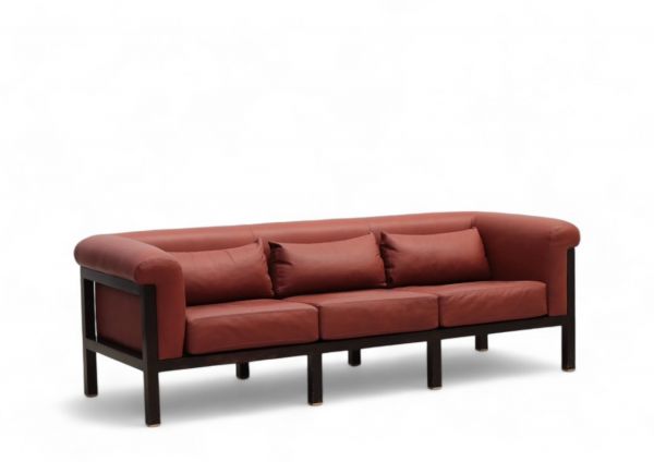 Jules WABBES (1919-1974) Three-seater sofa, black lacquered wood and red leather frame, brass base, circa 1960.