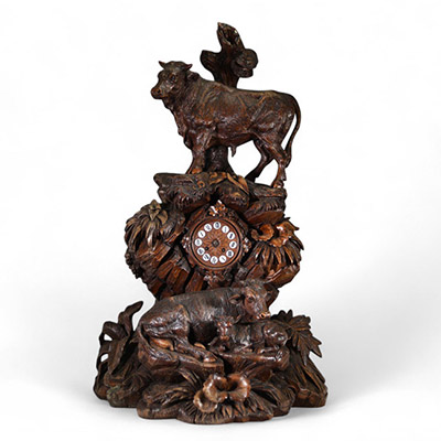 Switzerland, 19th century - Black Forest clock in carved wood