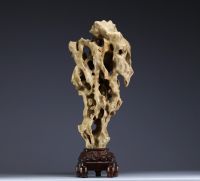 China - ‘Dream Stone’ sculpture, hard stone on wooden base, 19th century.