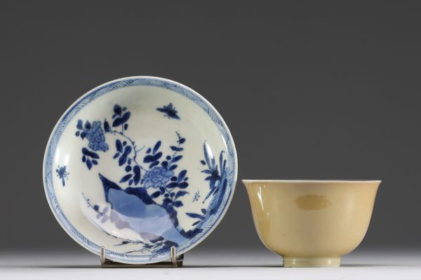 China - Bowl and plate in white-blue porcelain with floral decoration and exterior beige glaze, 18th century.