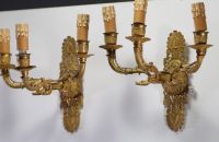 A pair of Empire ormolu sconces with three light points.