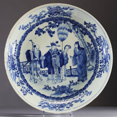 China - Large blue-white porcelain dish decorated with figures, Kangxi mark under the piece.