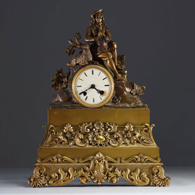 Pendule en bronze doré et patiné figurant un berger et son mouton, XIXème.