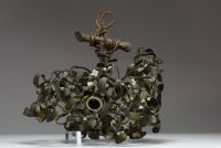 A three-light bronze chandelier with a green patina and opaline glass, representing a mistletoe ball, circa 1900.