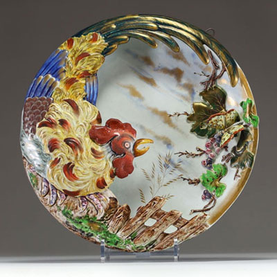 Louis MAJORELLE (1859-1926) and Keller & Guérin, Lunéville - Polychrome enamelled earthenware Bouquetière decorated with a cockerel and butterfly in relief in a country landscape, circa 1870, unsigned.