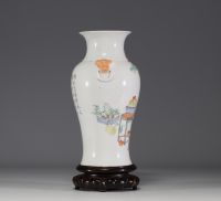 China - Famille rose porcelain vase decorated with traditional furniture and a poem.