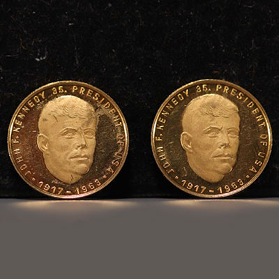 Set of two gold coins commemorating John F. Kennedy (1917-1963).