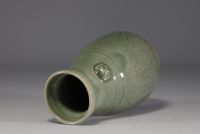 China - Celadon monochrome porcelain vase with floral design in relief.