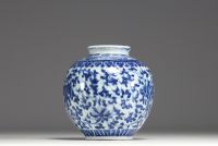China - A white-blue porcelain vase with floral decoration, 19th-20th century.