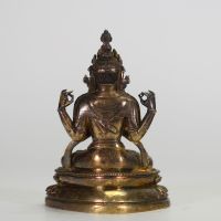 CHINE,  XIXe Figure d’Avalokiteśvara à quatre bras en bronze doré.