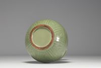 China - Monochrome porcelain vase with floral decoration in relief, 19th century.