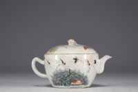 China - Polychrome porcelain teapot with floral decoration and cranes, mark under the piece.