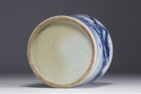 China - A white and blue porcelain brush with landscape decoration.
