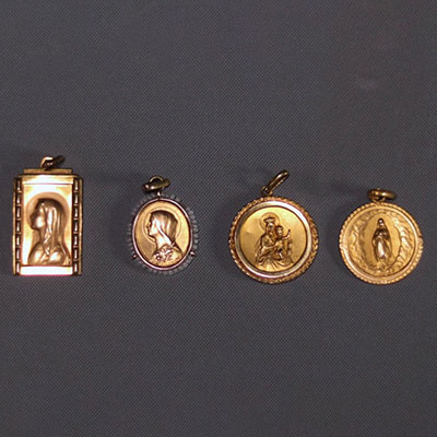 Set of four religious medals in yellow gold (2x18k and 2x9k) weighing 4.8gr.