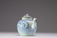 China - A white-blue porcelain teapot with floral decoration, late Ming period.