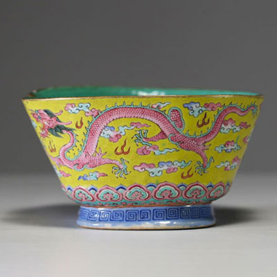 China - A pink family polychrome porcelain bowl decorated with an Imperial dragon on a yellow background, Tao Kuang mark and period.