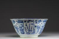China - Large blue-white porcelain bowl with floral decoration and figures, Kangxi.