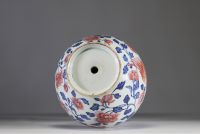 China - Polychrome porcelain vase decorated with a dragon, a phoenix and copper-red peony flowers, Qianlong period.