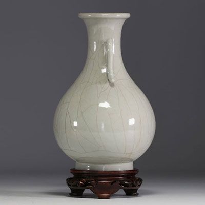 China - Monochrome porcelain vase on wooden base, blue mark under the piece.