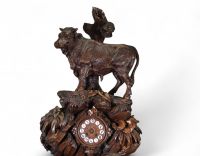Switzerland, 19th century - Black Forest clock in carved wood