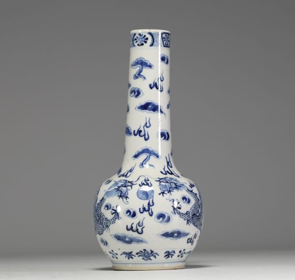 China - White-blue porcelain vase decorated with dragons, blue mark under the piece.