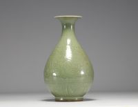 China - Monochrome porcelain vase with floral decoration in relief, 19th century.