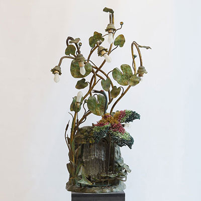 A rare Art Nouveau lamp decorated with a heron trimmed with pearls and water lilies in polychrome bronze.