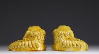 Asian- Pair of yellow porcelain figurative incense burners depicting dogs.