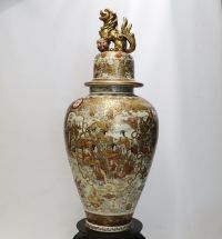 Japan - Imposing Satsuma covered vase decorated with dignitaries, magicians and courtesans, Meiji period.