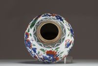 China - A polychrome porcelain vase decorated with flowers, trees and birds, 17th century.
