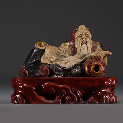Chine - Sculpture de Dignitaire polychrome en pierre sur socle en bois.