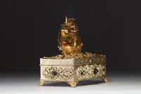 Silver and vermeil jewellery box, lid surmounted by a galleon, inlaid with cabochon semi-precious stones and pearls around the rim, Austria, 18th-19th century.