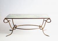 René DROUET (1899-1993) Gilded wrought iron coffee table with eglomised glass top, circa 1940