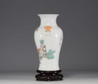 China - Famille rose porcelain vase decorated with traditional furniture and a poem.