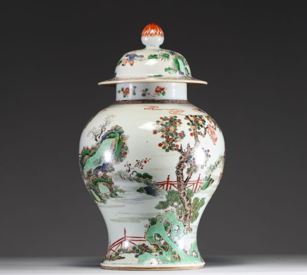China - Covered vase in green family polychrome porcelain decorated with characters, circle mark under the piece.