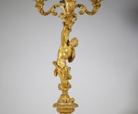 Très belle paire de candélabres à cinq feux en bronze doré et patiné à décor de faune et faunesse, XIXème.