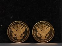 Set of two gold coins commemorating John F. Kennedy (1917-1963).