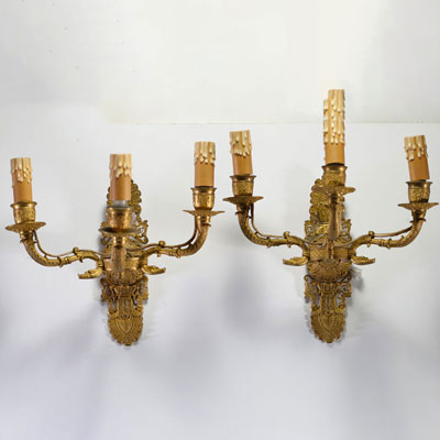 A pair of Empire ormolu sconces with three light points.