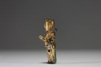 China - Ming period gilt bronze figurative statue of a servant.