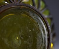 DAUM Nancy et Louis MAJORELLE (1859-1926) Blown and moulded glass bowl with gold leaf inclusions, hammered wrought iron mount, signed.