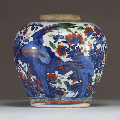 China - A polychrome porcelain vase decorated with flowers, trees and birds, 17th century.