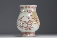 China - Iron-red porcelain vase decorated with fruit and bats, blue mark.