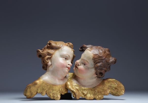 ‘Two heads of cherubs’ Polychrome wood carving, 18th century.