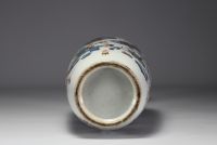 China - Large polychrome porcelain vase richly decorated with figures and furniture, 19th century.