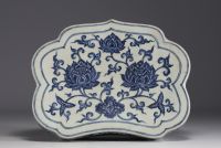 China - Headrest in white-blue porcelain with floral decoration.