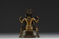 China - Tibet - A 17th century ormolu figure of Shadakshari Lokeshvara.