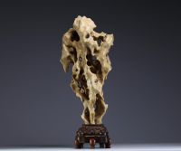 China - ‘Dream Stone’ sculpture, hard stone on wooden base, 19th century.