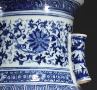 China - Large Hu-shaped vase in blue-white porcelain with floral decoration and bamboo handles, 19th century