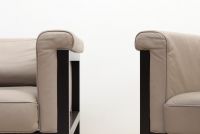 JULES WABBES (1919-1974) Pair of ‘Livourne’ armchairs Series 800 Bulo edition in black lacquered wood and taupe grey leather.